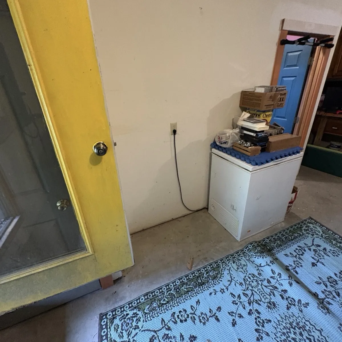 After: The same wall with the shelving removed